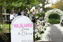 Load image into Gallery viewer, Wedding welcome sign with floral arrangements at an outdoor event.